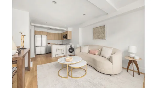 a living room with furniture and a table
