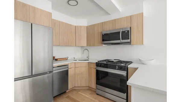 a kitchen with a stove and a microwave