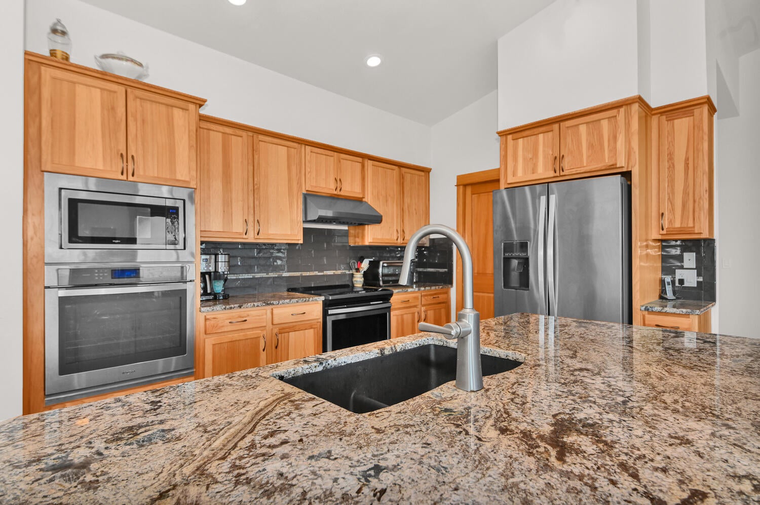 62860 Deschutes Road Bend, OR 97701 - Photo 7 of 34 Kitchen has granite counter tops and hickory cabinets