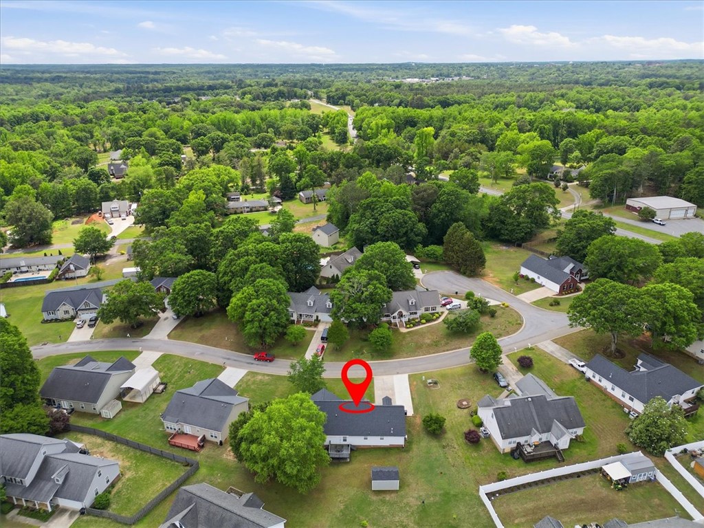 166 Amberwood Drive Anderson, SC 29621 - Photo 36 of 38 An aerial view showcases a peaceful residential neighborhood surrounded by abundant green trees.