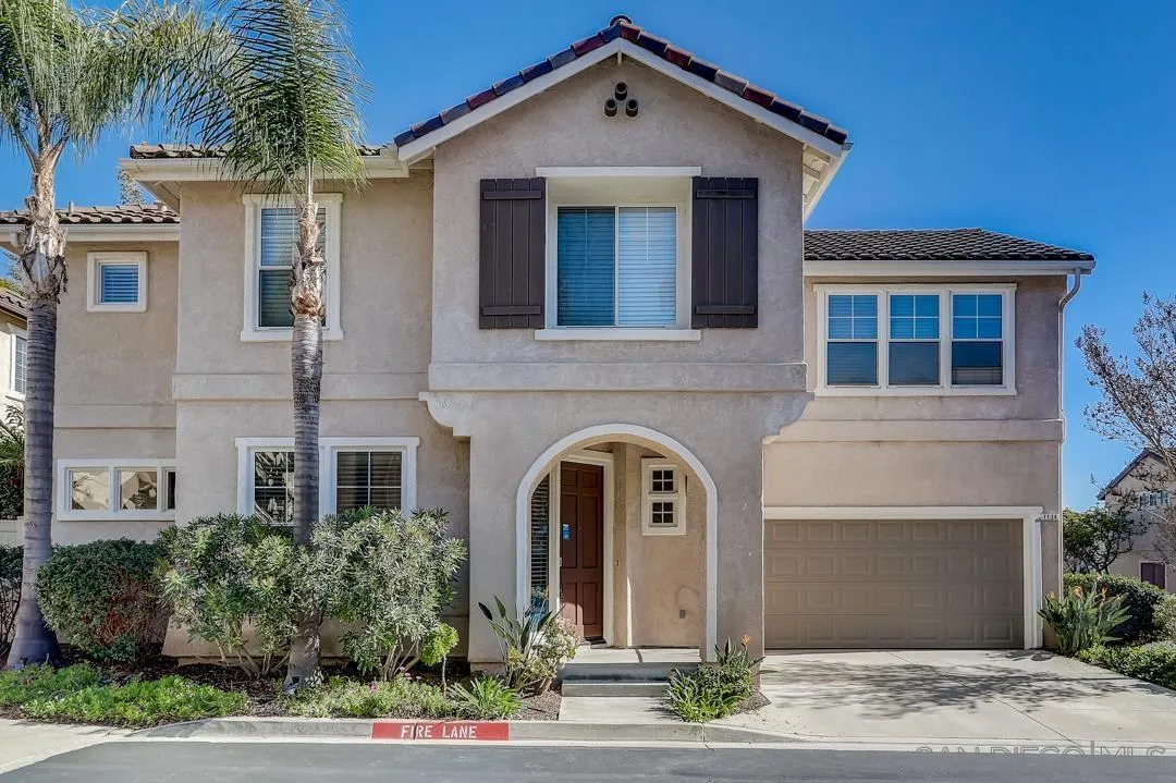 a front view of a house with yard