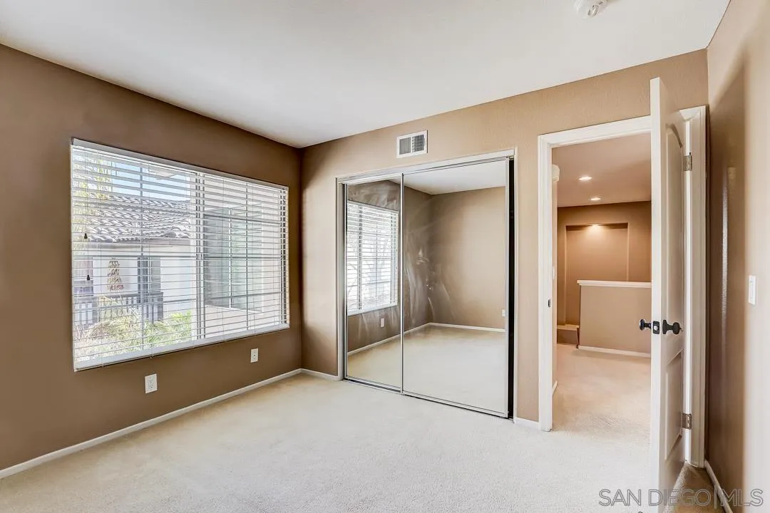 7134 Pintail Drive Carlsbad, CA 92011 - Photo 15 of 30 a view of an empty room with a window
