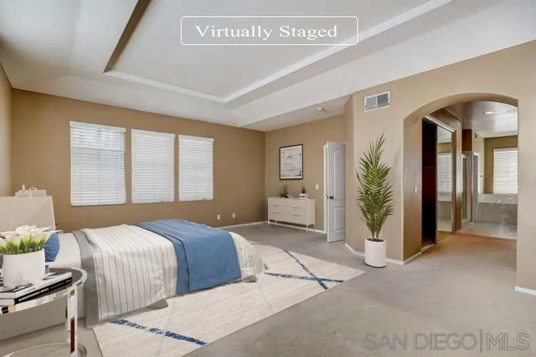 7134 Pintail Drive Carlsbad, CA 92011 - Photo 3 of 30 a bedroom with a balcony a bed and a painting on the wall