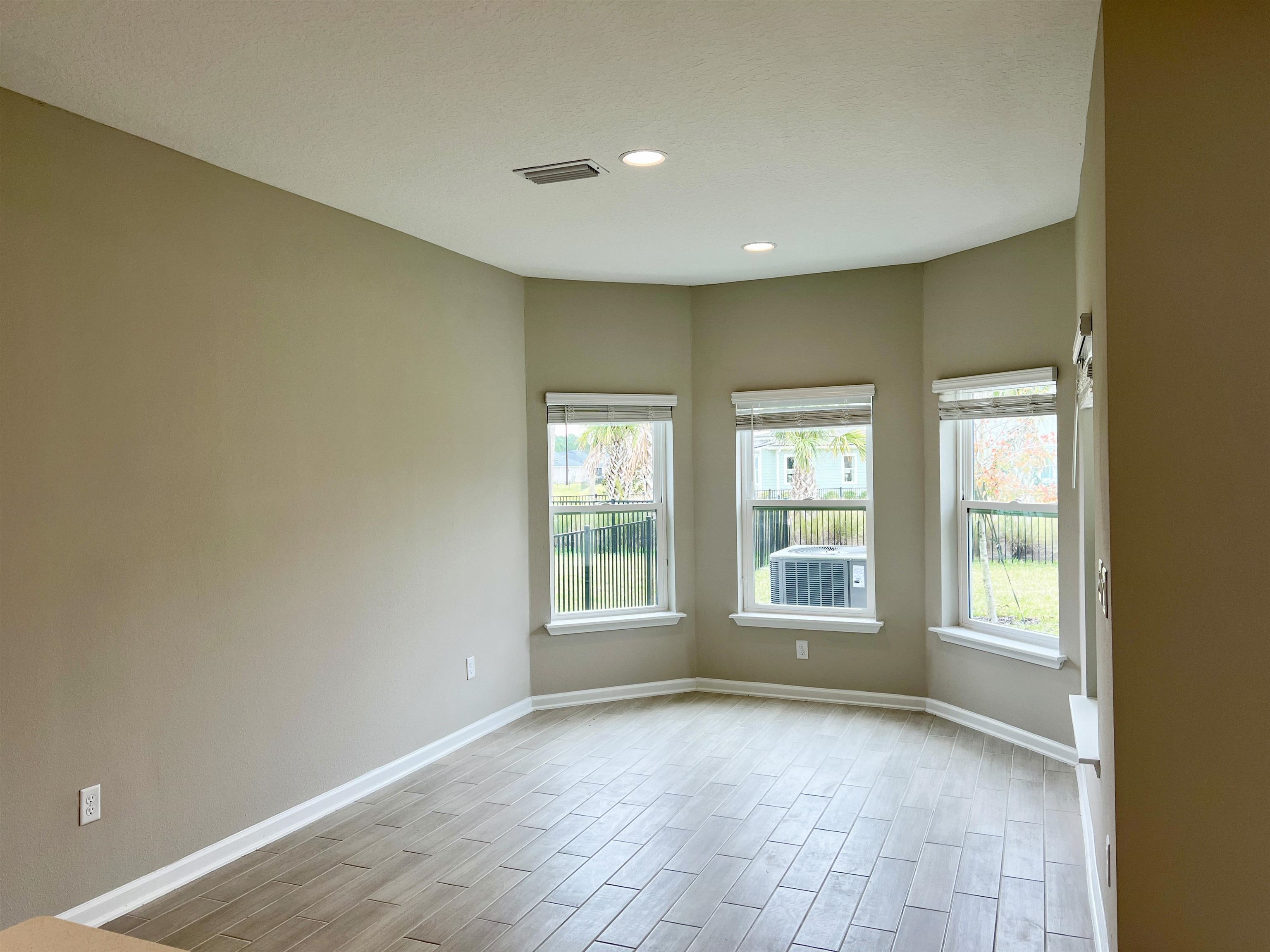385 Brookgreen Way St. Augustine, FL 32092 - Photo 7 of 31 a view of an empty room with a window