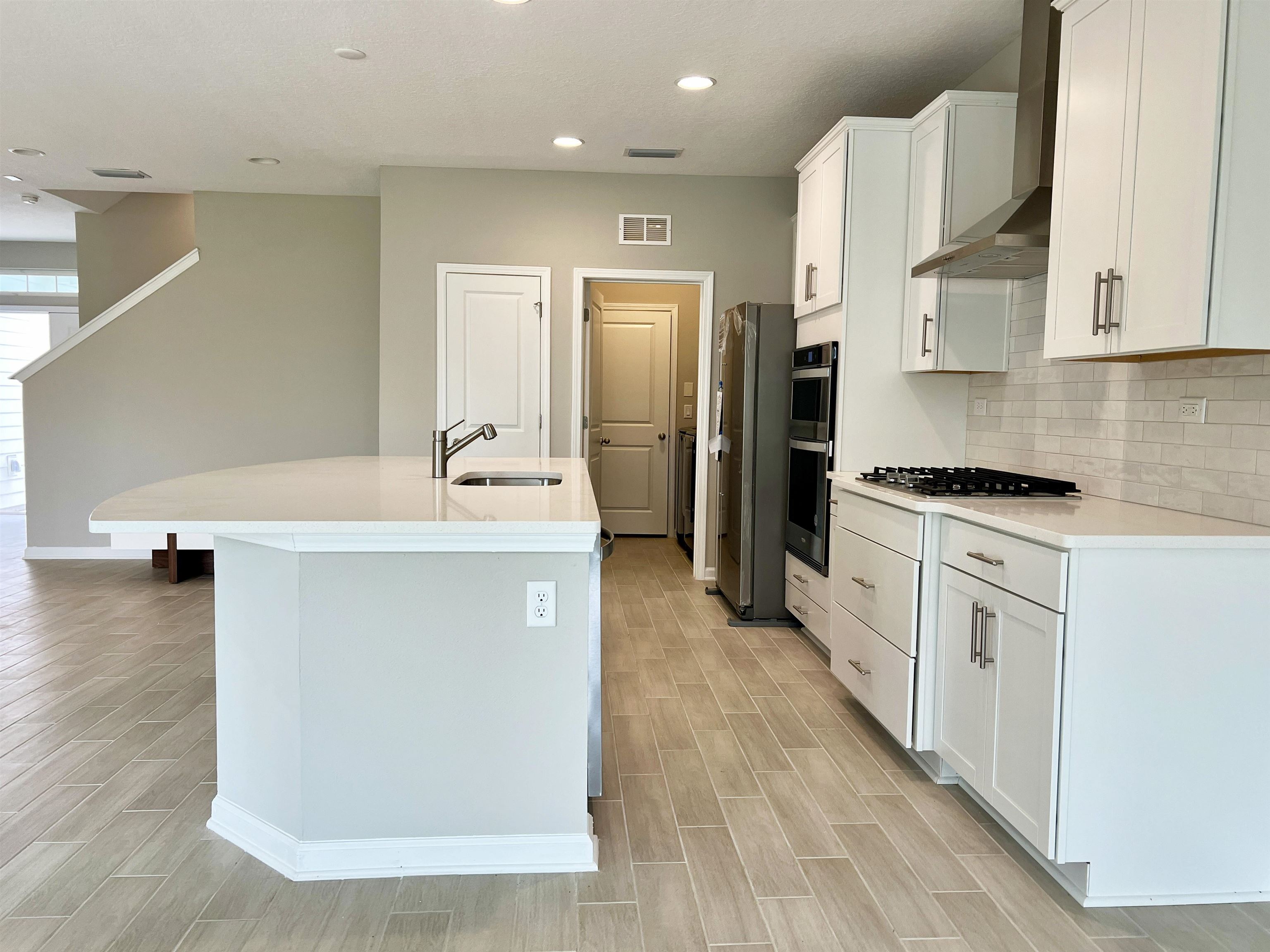 385 Brookgreen Way St. Augustine, FL 32092 - Photo 8 of 31 a kitchen with a sink appliances and cabinets