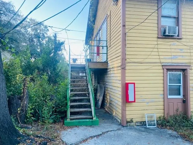 a front view of a house with stairs
