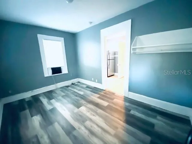 a view of empty room with window and stairs