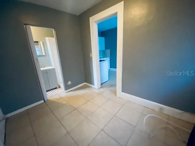 a view of an empty room and closet area