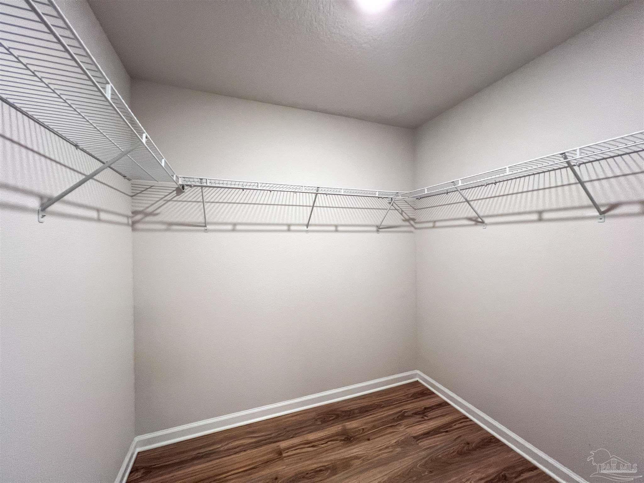 6351 Burrow Lane Pensacola, FL 32526 - Photo 13 of 25 a view of a room with racks on the wall