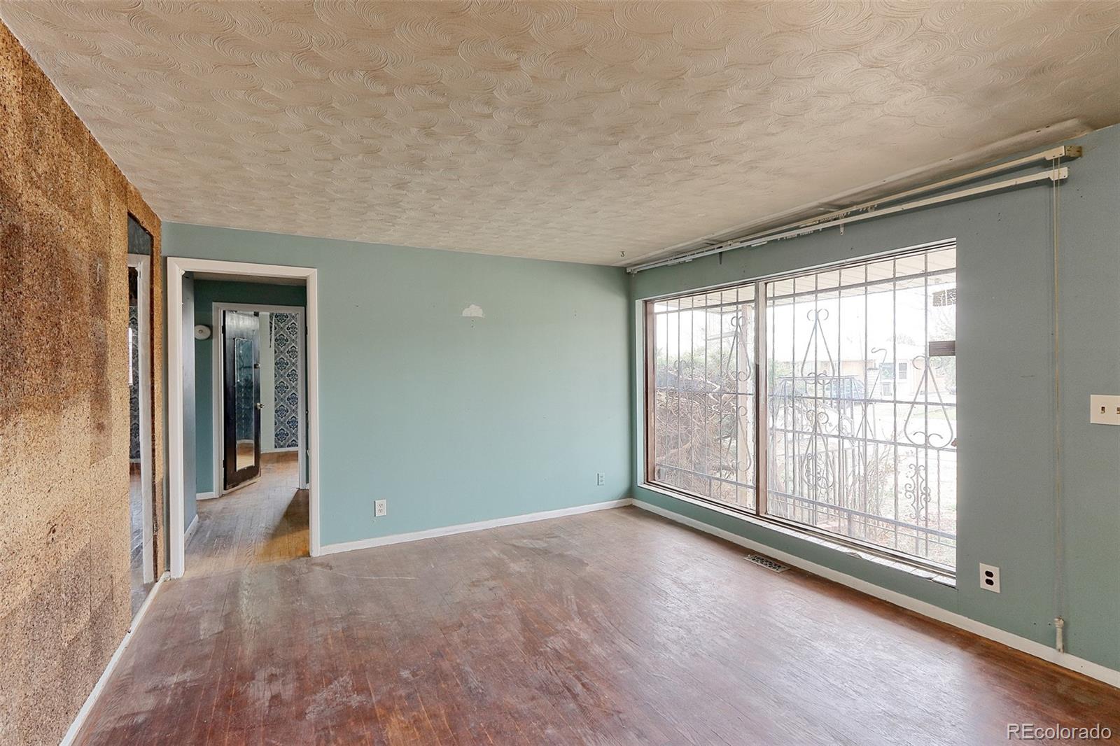 7190 Beach Street Westminster, CO 80030 - Photo 2 of 19 an empty room with windows