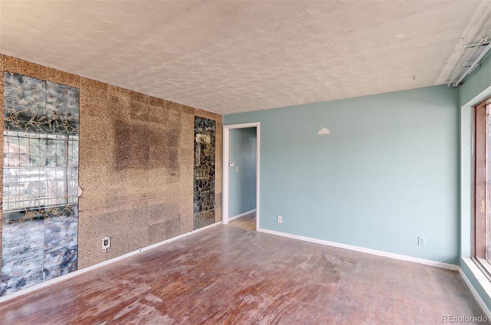 7190 Beach Street Westminster, CO 80030 - Photo 3 of 19 a view of an empty room with a window