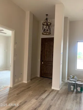 an entryway with wooden floor