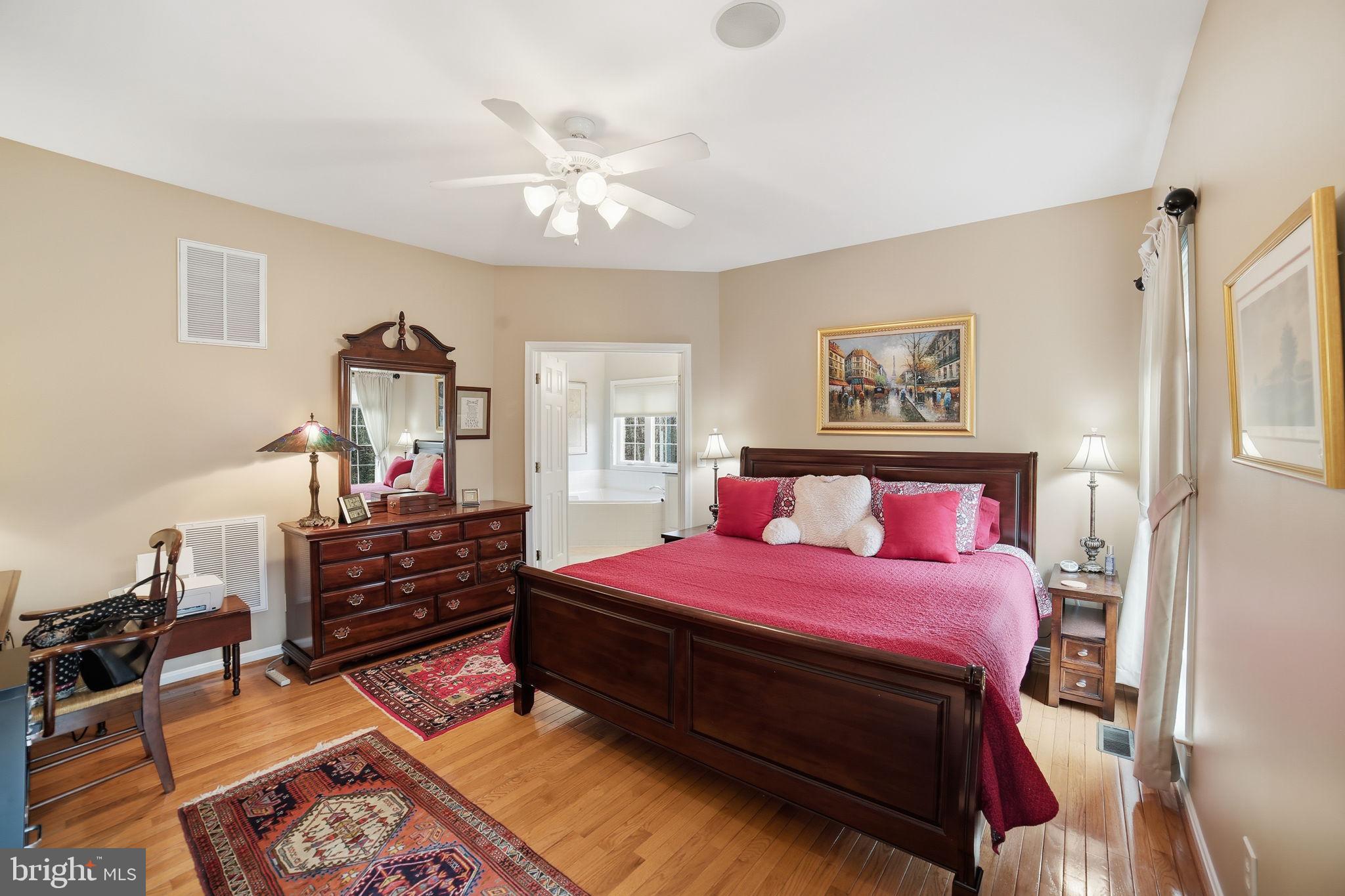 7730 Riparian Court Fredericksburg, VA 22408 - Photo 12 of 24 a bedroom with a bed and wooden floor