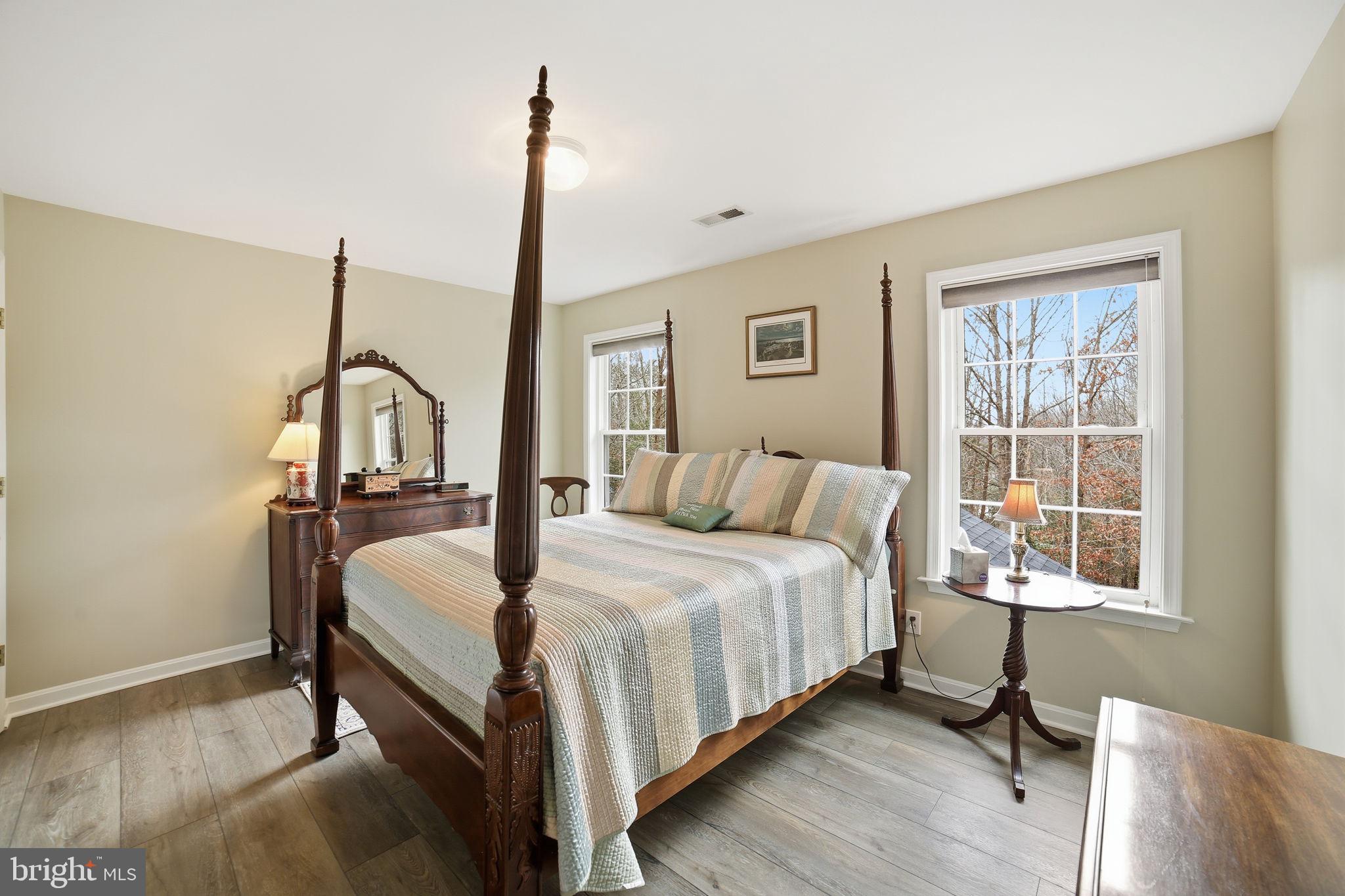 7730 Riparian Court Fredericksburg, VA 22408 - Photo 15 of 24 a bedroom with a bed and a window