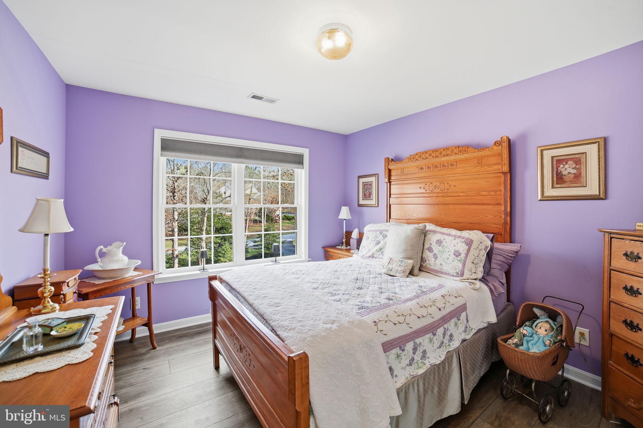 7730 Riparian Court Fredericksburg, VA 22408 - Photo 17 of 24 a bed room with a bed and a chair