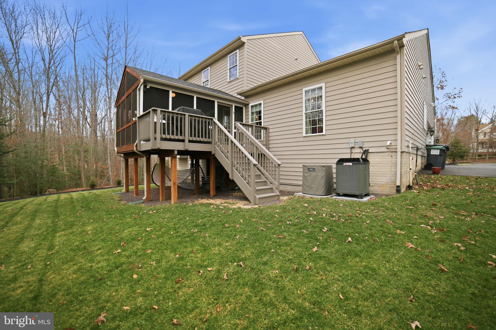 7730 Riparian Court Fredericksburg, VA 22408 - Photo 20 of 24 a view of a house with a yard
