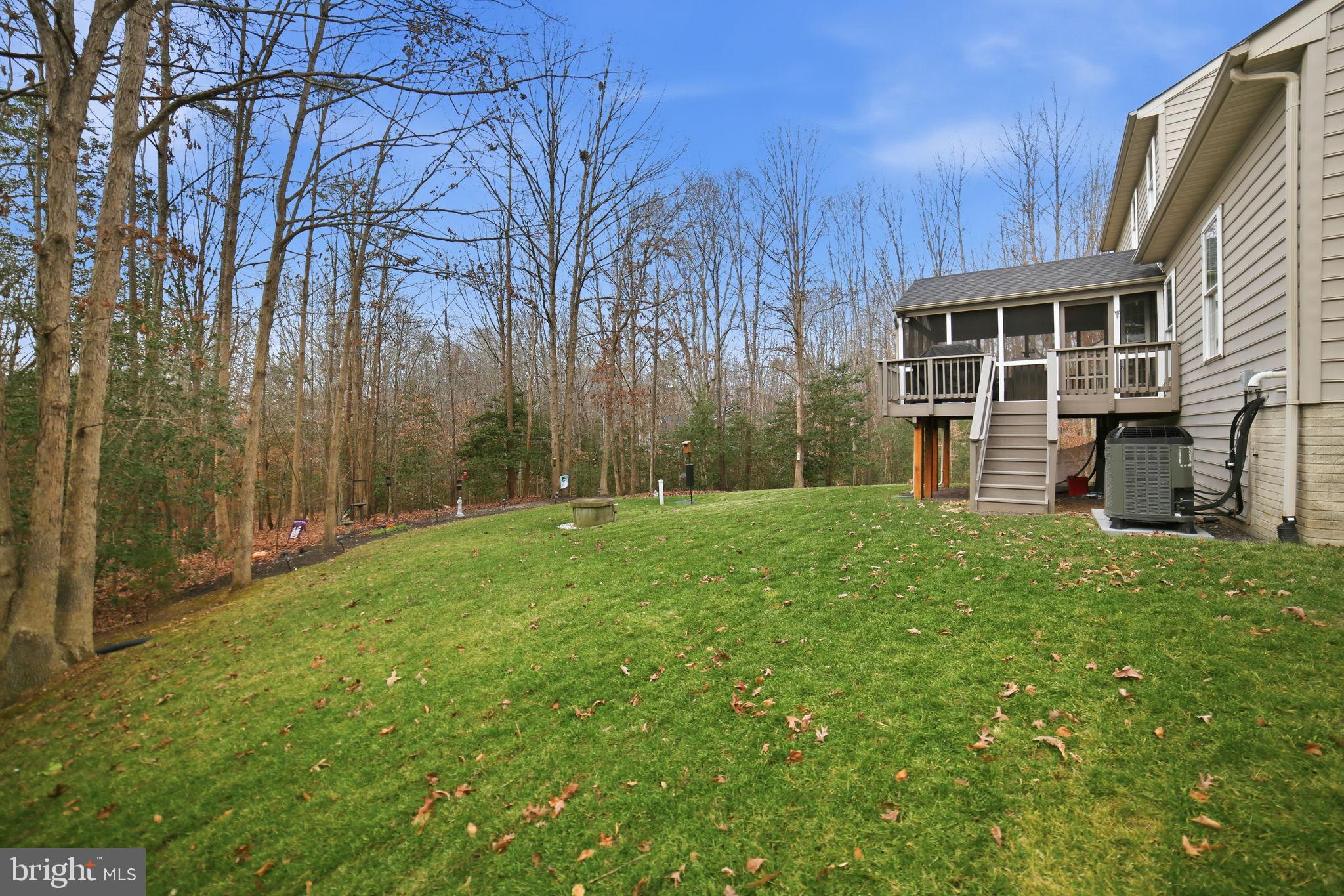 7730 Riparian Court Fredericksburg, VA 22408 - Photo 23 of 24 a view of a house with backyard and garden