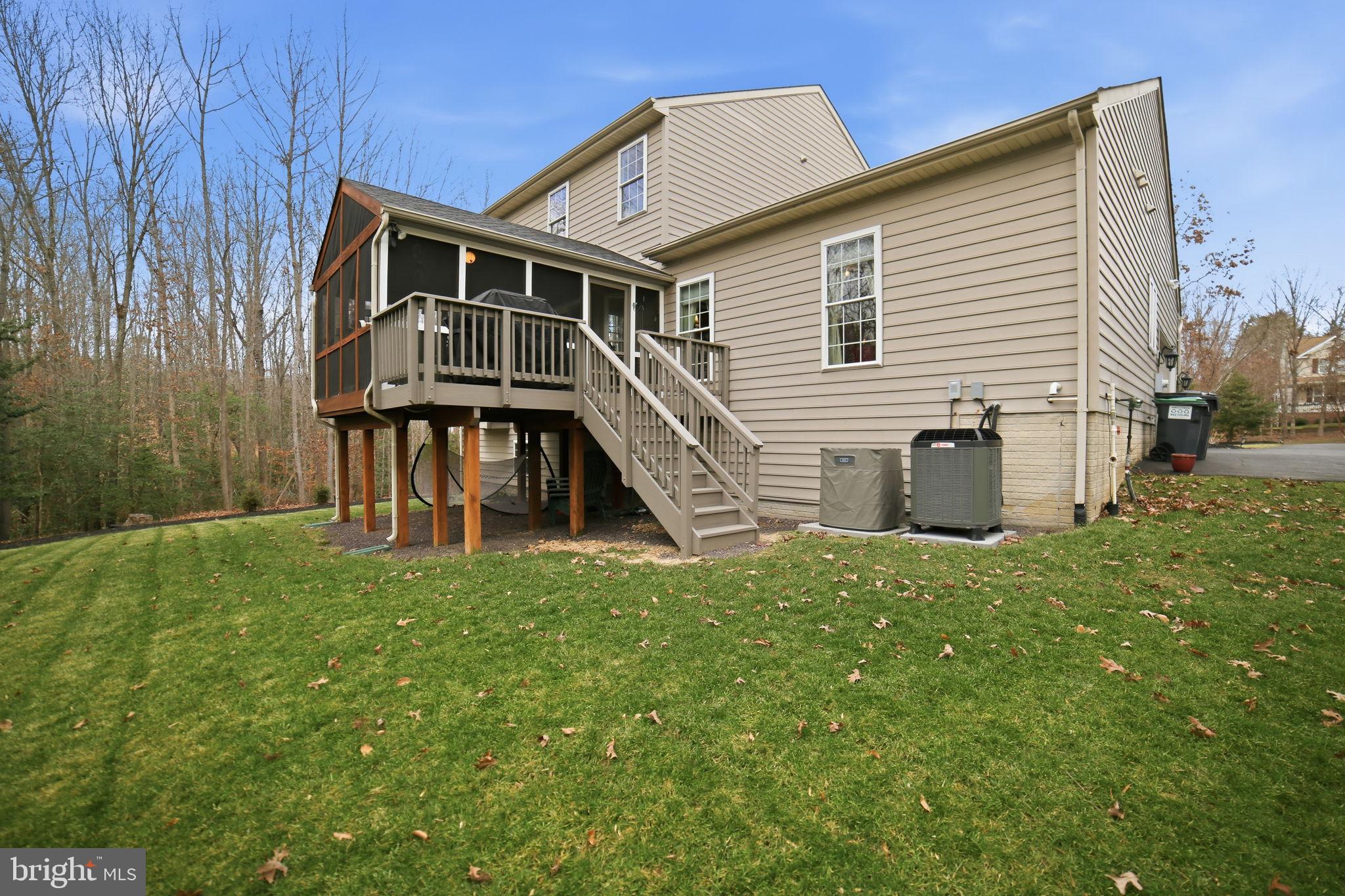 7730 Riparian Court Fredericksburg, VA 22408 - Photo 3 of 24 a view of a house with a yard