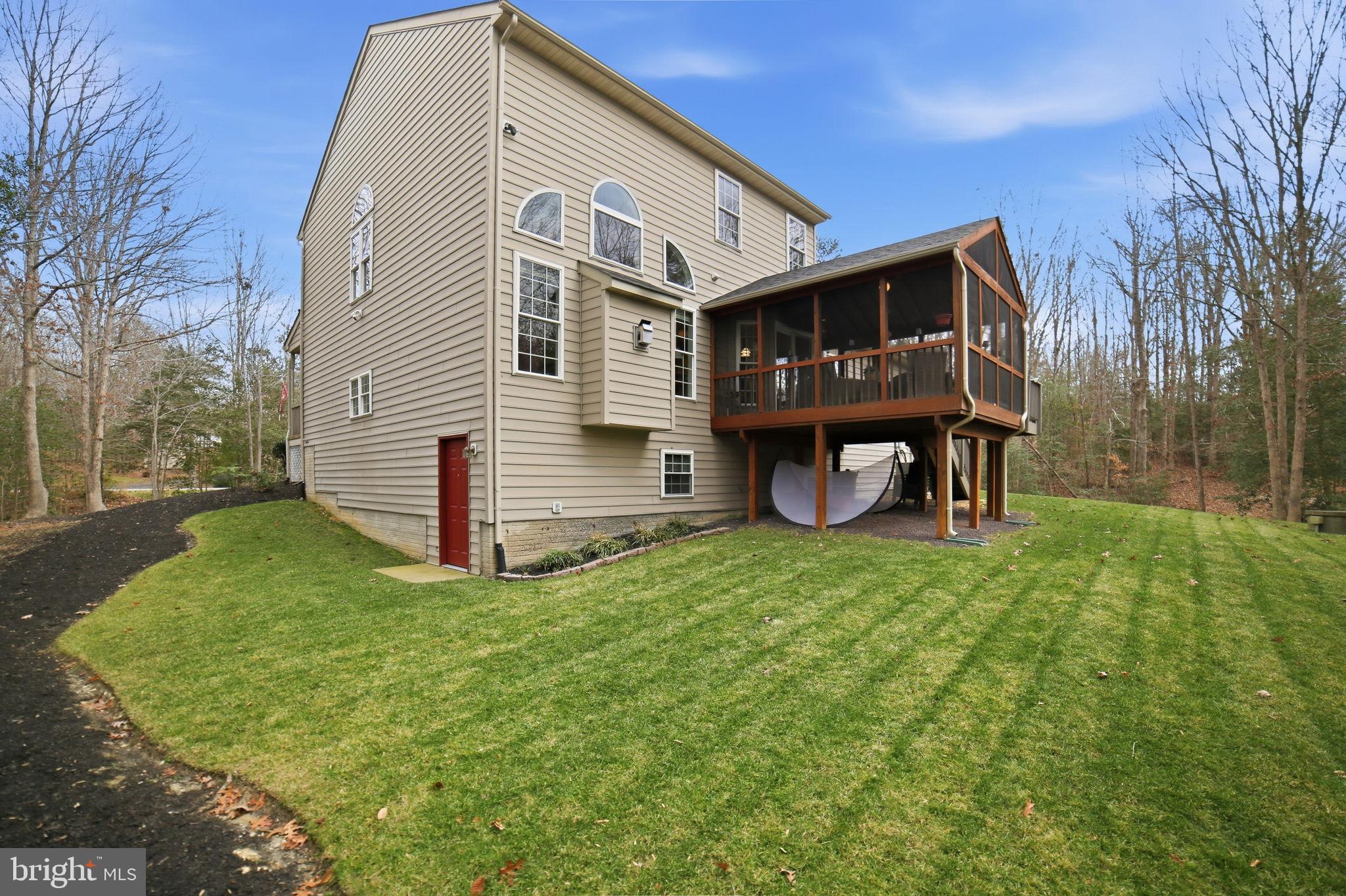 7730 Riparian Court Fredericksburg, VA 22408 - Photo 4 of 24 a view of house with backyard