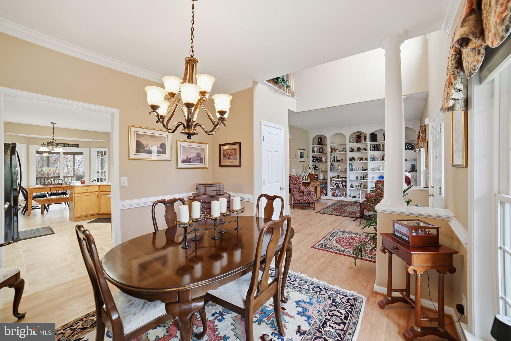 7730 Riparian Court Fredericksburg, VA 22408 - Photo 5 of 24 a view of a dining room with furniture and chandelier