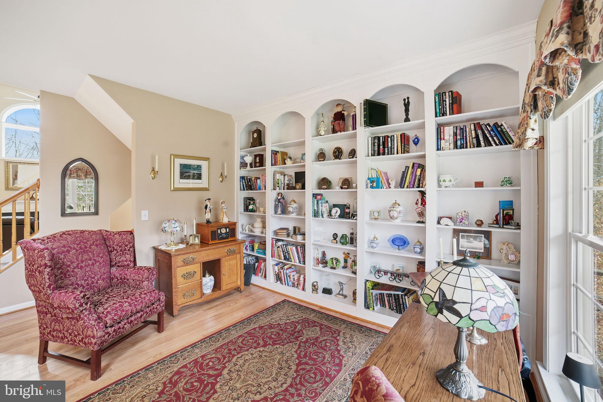 7730 Riparian Court Fredericksburg, VA 22408 - Photo 6 of 24 a living room with furniture cabinets and wooden floor