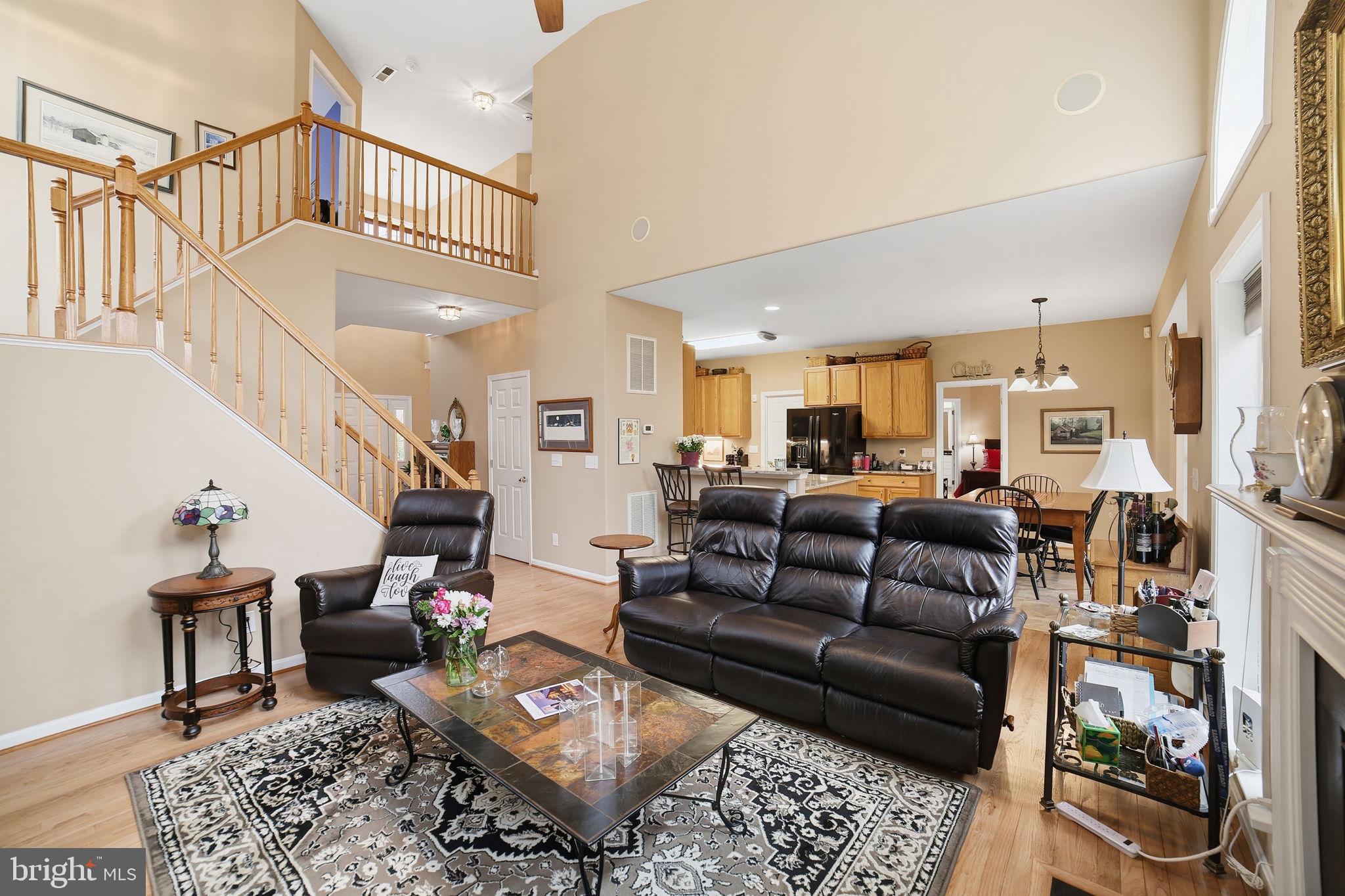 7730 Riparian Court Fredericksburg, VA 22408 - Photo 10 of 24 a living room with furniture wooden floor and a rug