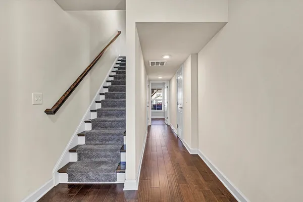 a view of entryway with wooden floor