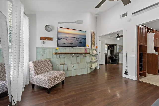 a bathroom with a granite countertop toilet sink and mirror