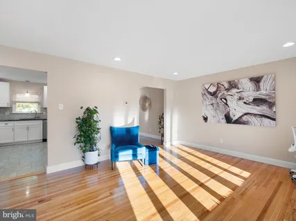 a view of a room with furniture and wooden floor