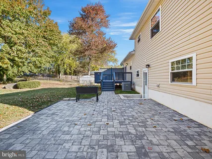a chairs and a table in backyard of house