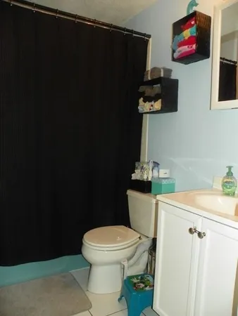 a bathroom with a toilet and a sink