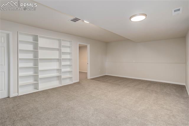 5208 Pinon Valley Road Colorado Springs, CO 80919 - Photo 21 of 27 Rec room w/ built-in shelves