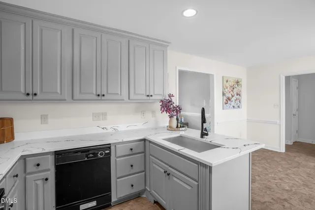 a kitchen with a sink and cabinets