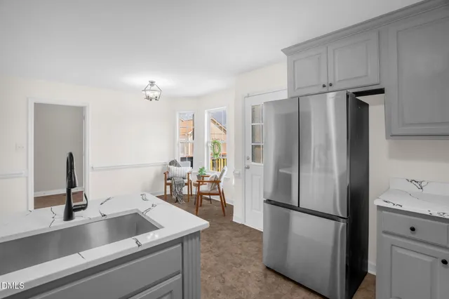 a kitchen with refrigerator and car