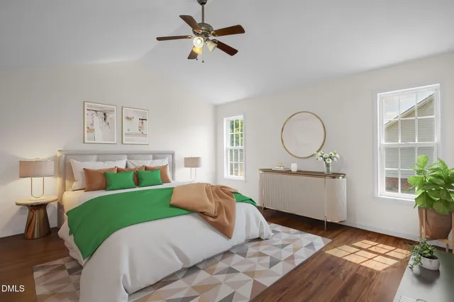 a bed room with a bed mirror and a window