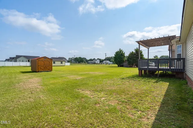 a view of a water fountain and a big yard