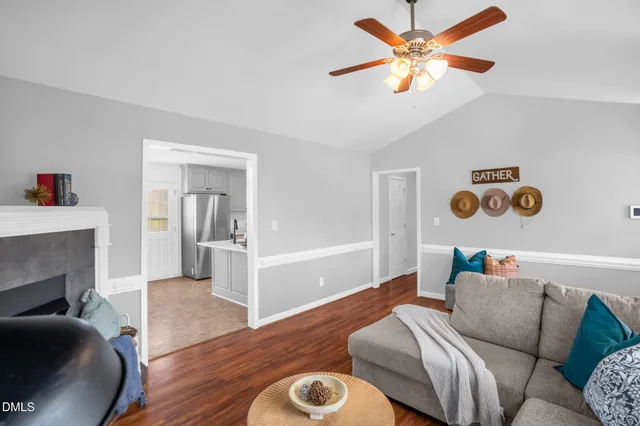 a living room with furniture and a fireplace