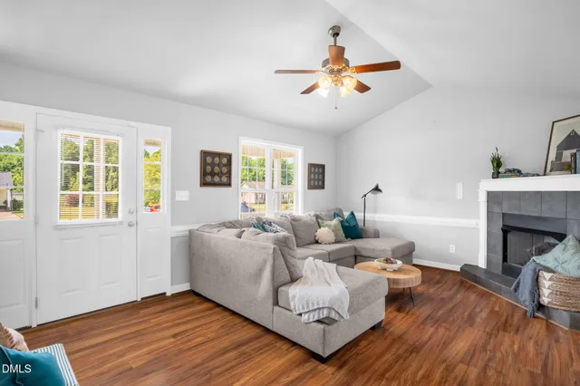 a living room with furniture and a fireplace
