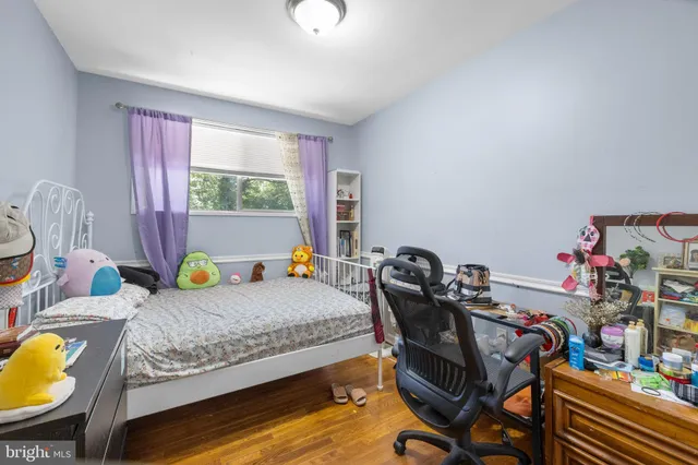 a bedroom with bed and a window