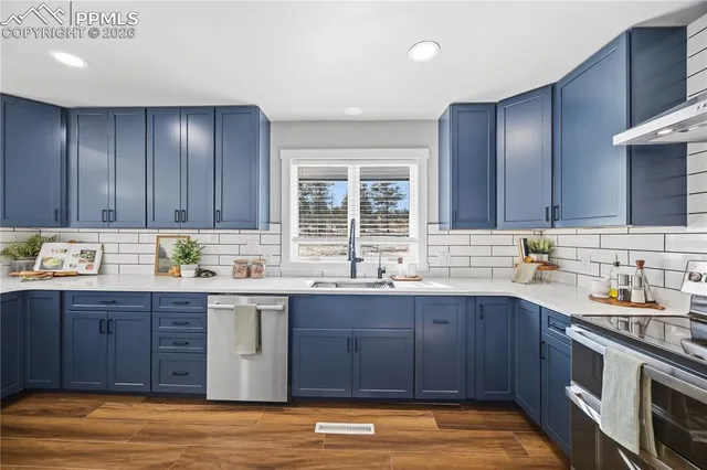 a kitchen with a sink and cabinets
