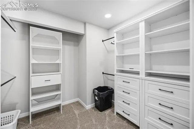 a view of an empty walk in closet