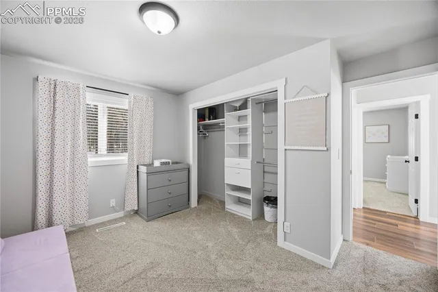 a bathroom with a sink a toilet and a large mirror