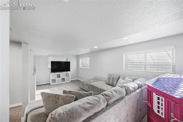 a bedroom with a bed and a lamp