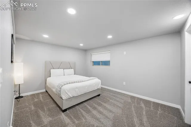 a bathroom with a granite countertop sink mirror and shower