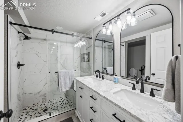 a bedroom with furniture and natural light