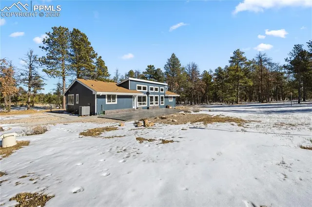 a view of a street with a building in the background