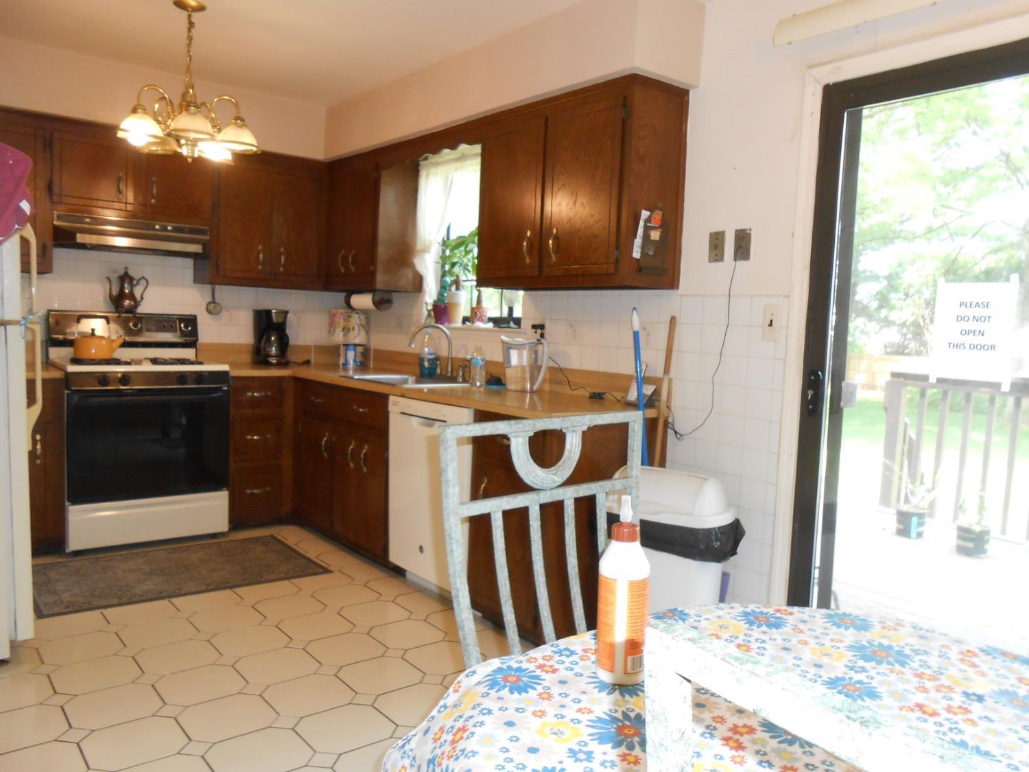 93 Pheasant Run Edison, NJ 08820 - Photo 11 of 24 a kitchen with stainless steel appliances kitchen island granite countertop a sink and cabinets