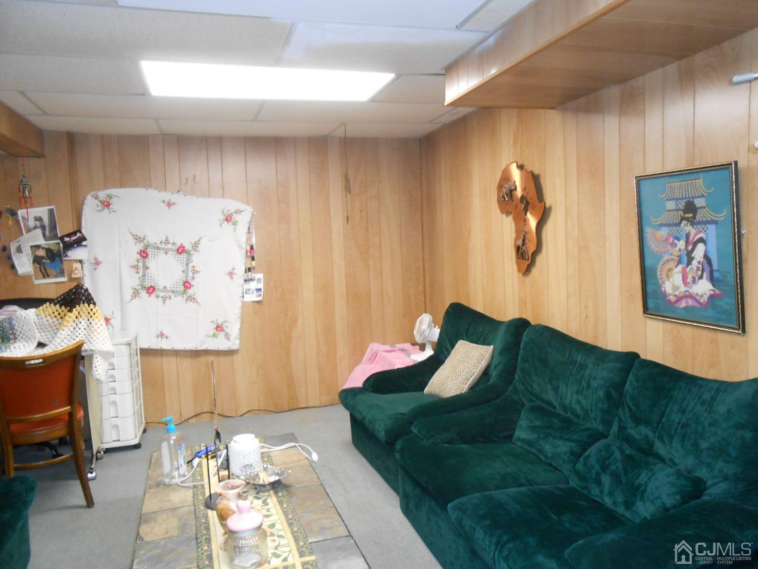 93 Pheasant Run Edison, NJ 08820 - Photo 20 of 24 a bed room with a bed and a couch