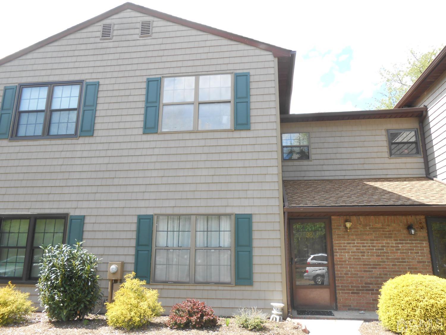93 Pheasant Run Edison, NJ 08820 - Photo 2 of 24 a front view of a house with a yard