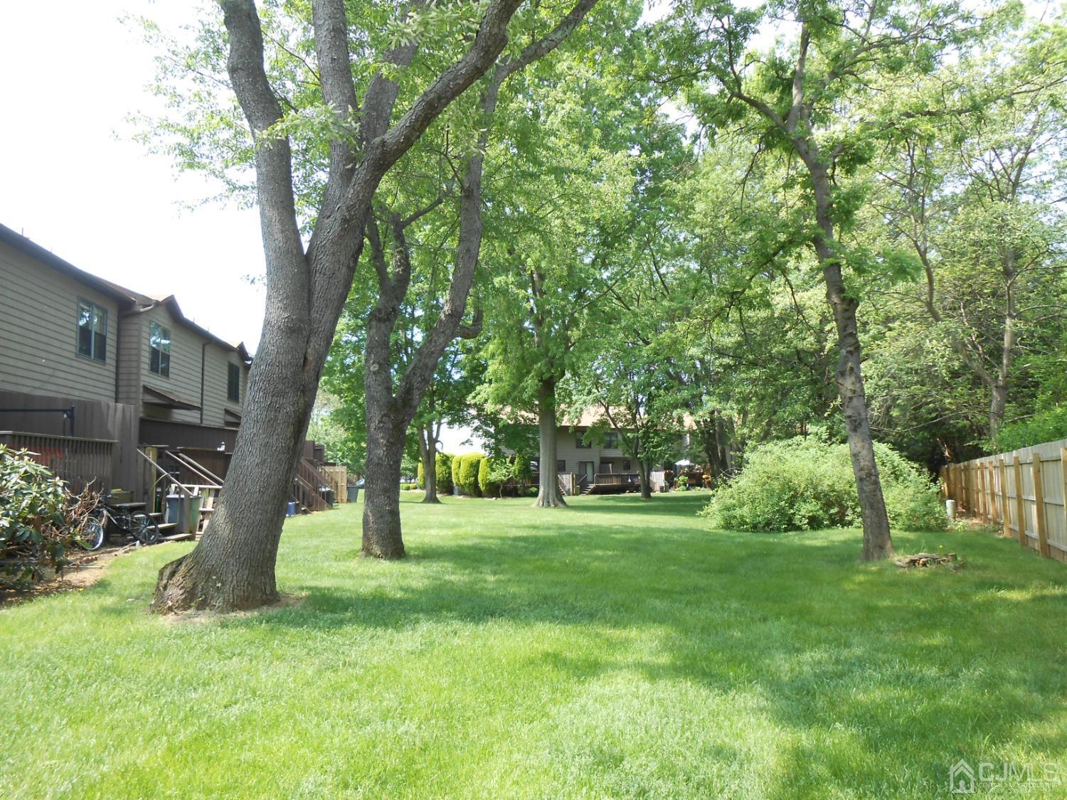 93 Pheasant Run Edison, NJ 08820 - Photo 24 of 24 a view of a yard with a tree